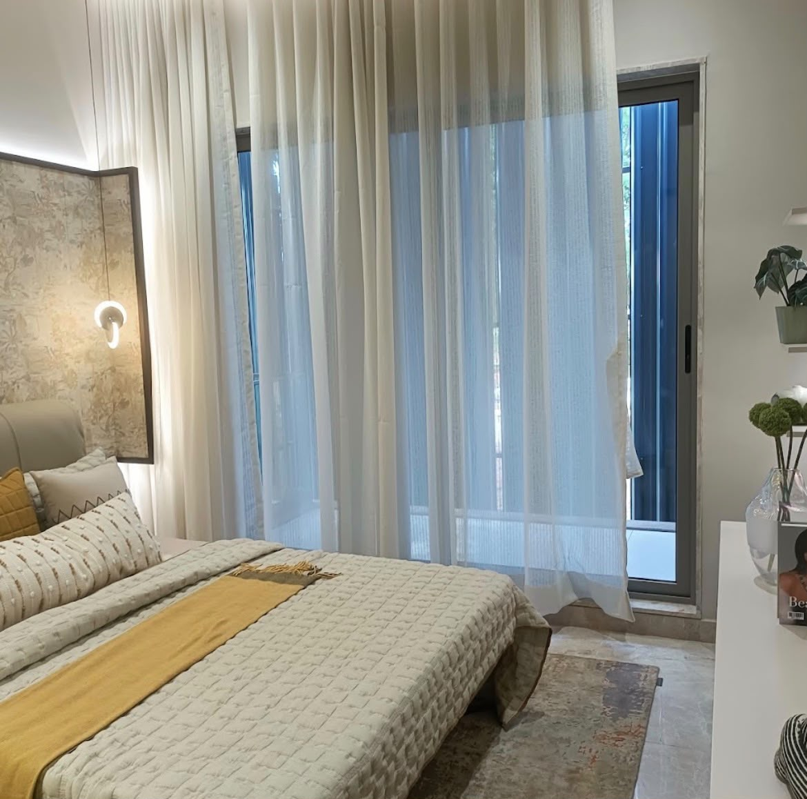 Arvind Sylva luxury bedroom with contemporary interiors and private balcony